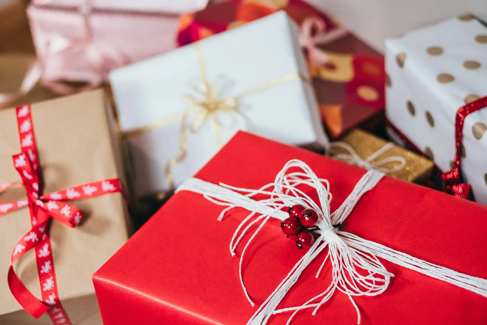 Red wrapped gift boxes tied with white string